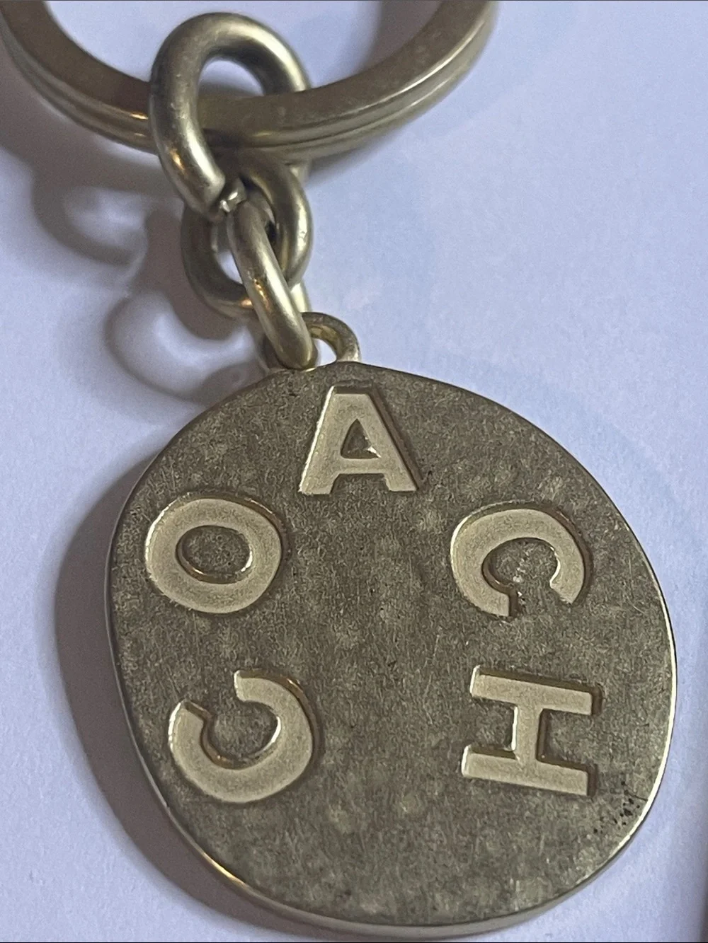 Coach Brass-Tone Round Logo Keychain and Coach Pen